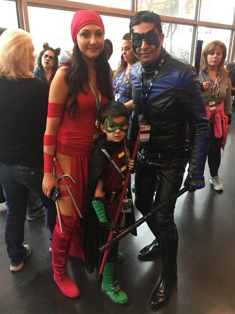 Elektra and Nightwing pose with the boy wonder.